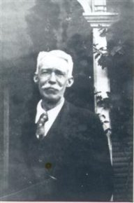 John William Keating, son of John Charles and Julia C. (Hyland) Keating, standing in front of the house in Frostburg.